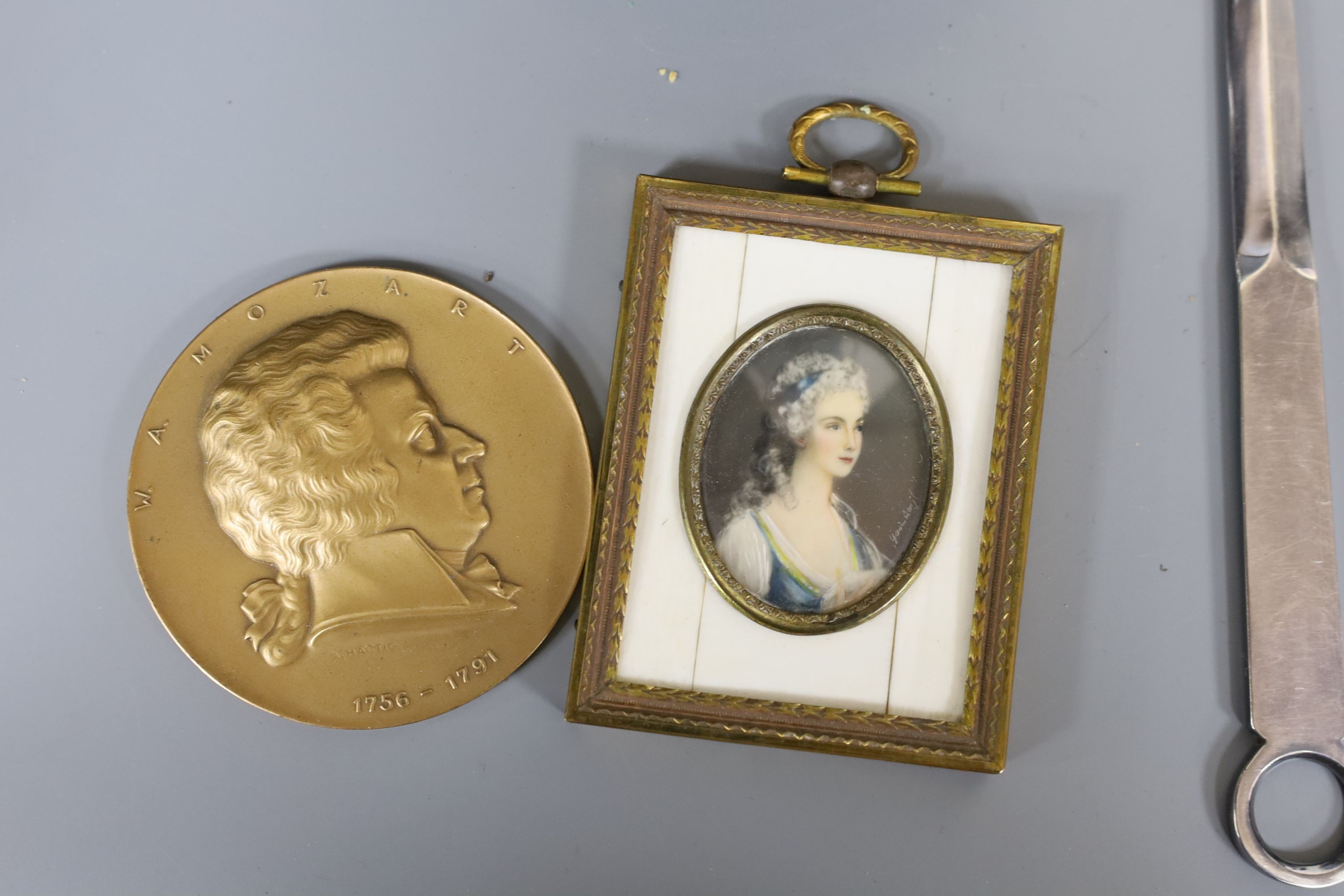 A Victorian hand mirror, four plated coasters, framed miniature and three other items